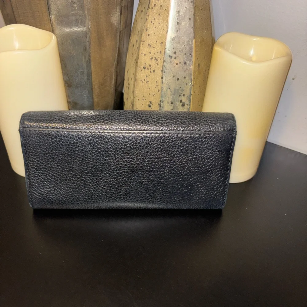 Michael Kors Fulton Large Flap Continental Wallet in black pebbled leather.